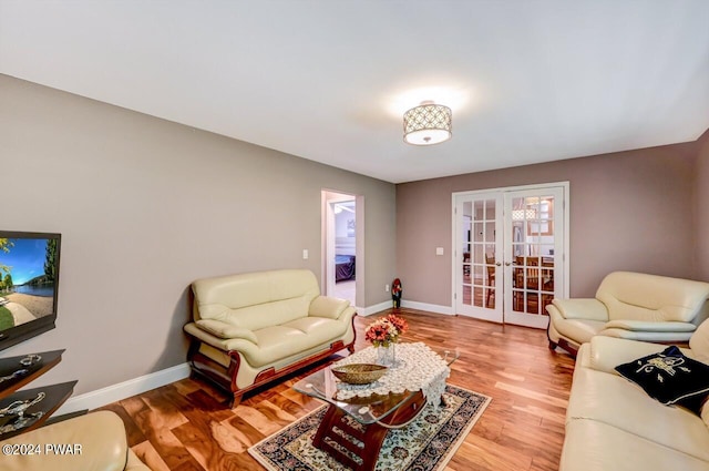 living room featuring french doors and hardwood / wood-style floors