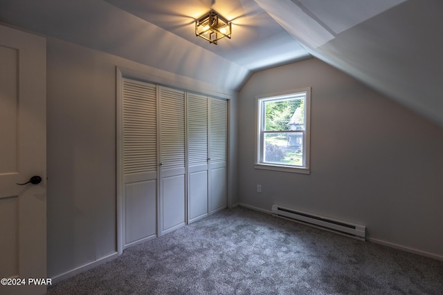 bonus room featuring a baseboard heating unit, carpet floors, vaulted ceiling, and baseboards