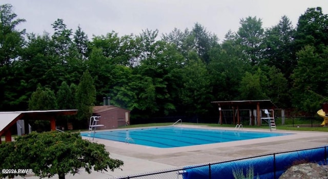 pool featuring a patio and fence