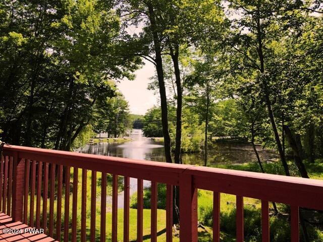 wooden deck with a water view