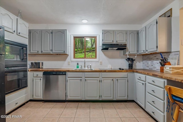 102 Keystone Ct, Dingmans Ferry, PA 18328 - kitchen with black appliances, under cabinet range hood, gray cabinets, and tasteful backsplash