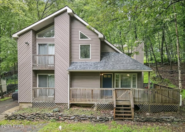 102 Keystone Ct, Dingmans Ferry, PA 18328 - view of front of house with a shingled roof, a chimney, and covered porch
