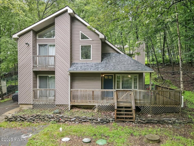 102 Keystone Ct, Dingmans Ferry, PA 18328 - view of front of house featuring a shingled roof, a chimney, and a porch