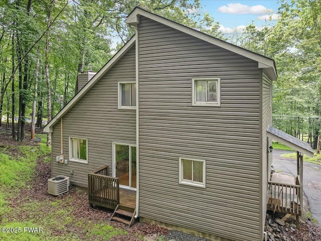 102 Keystone Ct, Dingmans Ferry, PA 18328 - view of side of property featuring a central air condition unit and a chimney