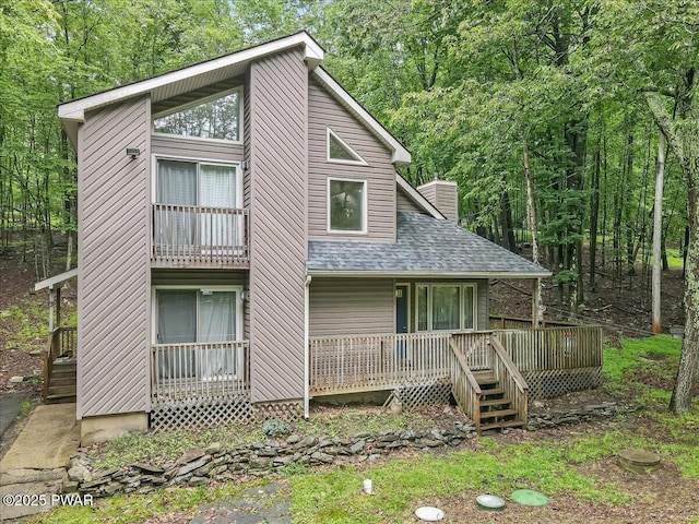 102 Keystone Ct, Dingmans Ferry, PA 18328 - view of front of property with roof with shingles and a chimney