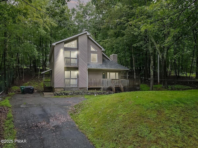 102 Keystone Ct, Dingmans Ferry, PA 18328 - view of front of property with a chimney, a front yard, and a deck