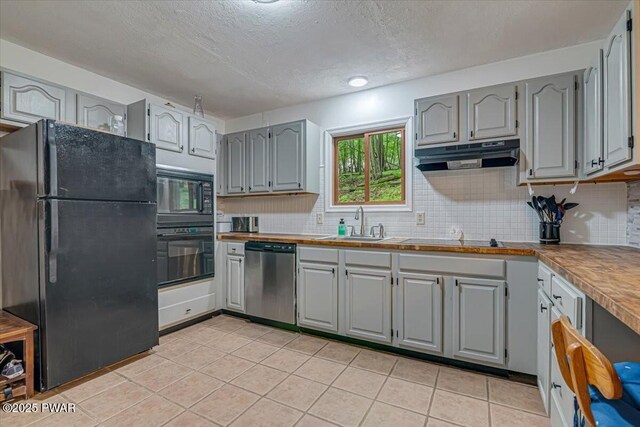 102 Keystone Ct, Dingmans Ferry, PA 18328 - kitchen with black appliances, gray cabinets, under cabinet range hood, light tile patterned floors, and a textured ceiling