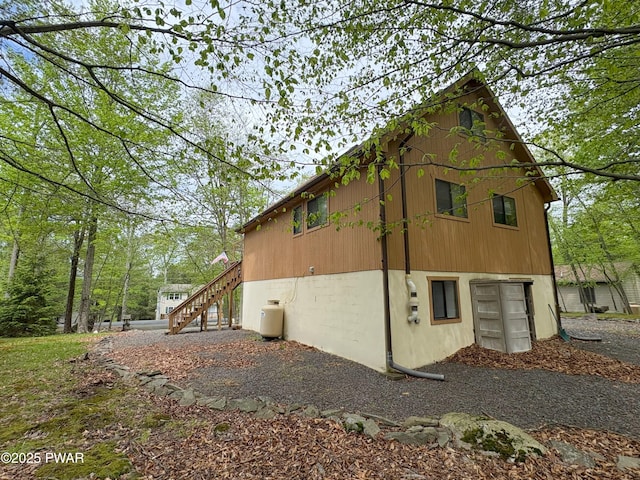 view of side of home with stairway