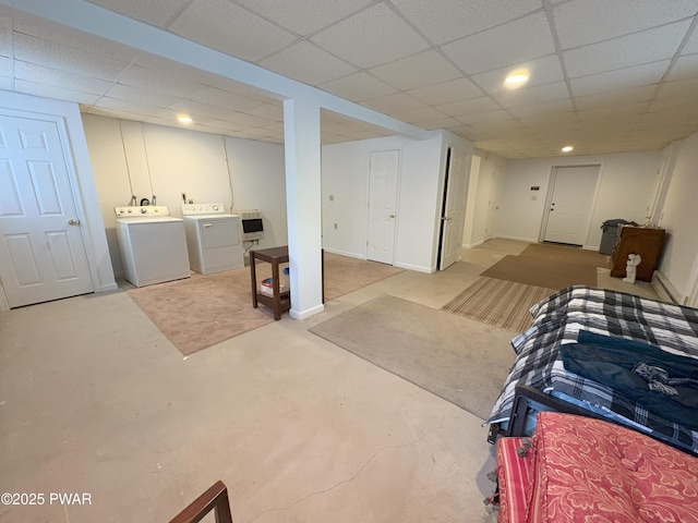 finished below grade area featuring independent washer and dryer and a paneled ceiling