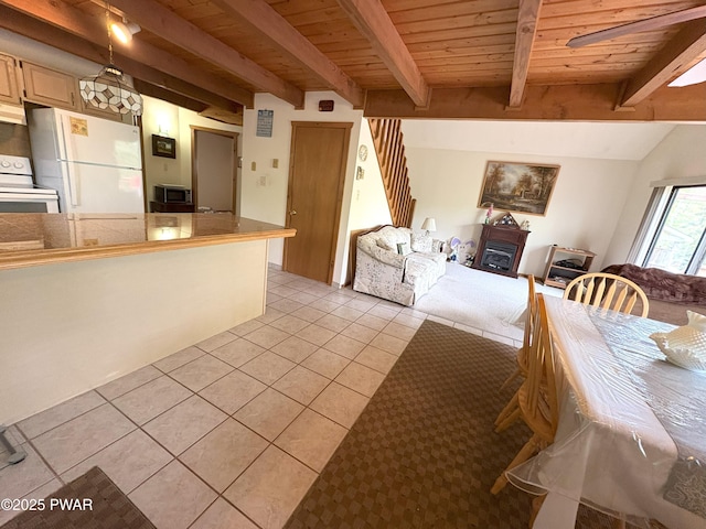 living area featuring light tile patterned floors and wood ceiling