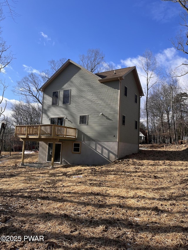 back of property with a deck