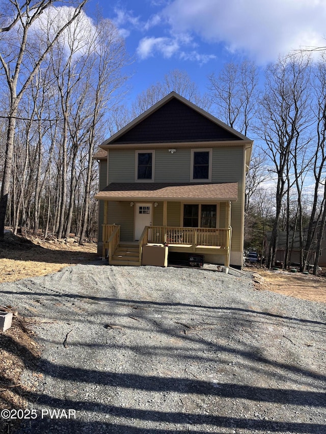 view of property featuring covered porch