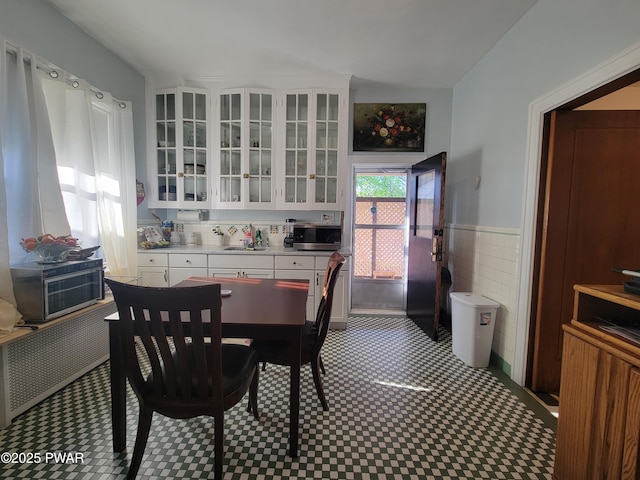 1237 S Main St, Old Forge, PA 18518 - dining space with tile walls and wainscoting