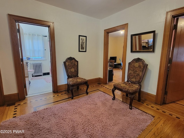 1237 S Main St, Old Forge, PA 18518 - living area featuring radiator heating unit, light wood-style flooring, and baseboards