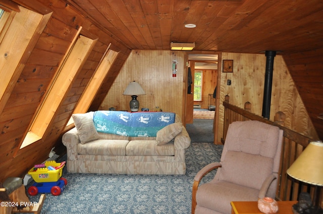 interior space with carpet floors, wooden ceiling, and wooden walls