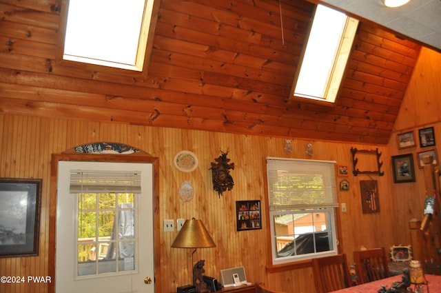 interior space with lofted ceiling with skylight