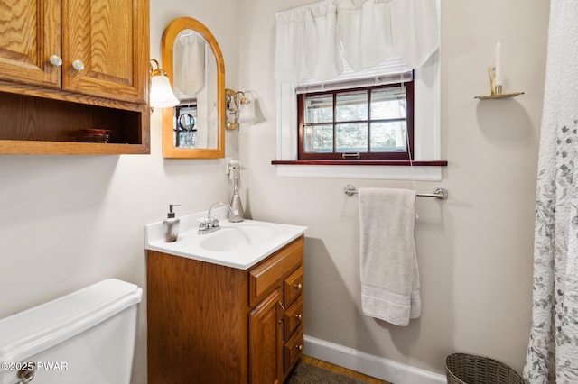 bathroom with vanity and toilet