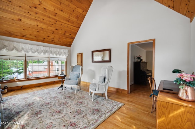 living area featuring baseboards, light wood-style floors, high vaulted ceiling, and wooden ceiling