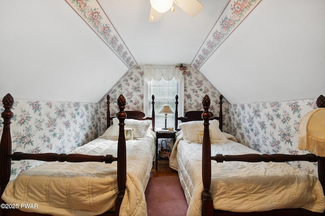 bedroom featuring carpet floors, wallpapered walls, vaulted ceiling, and ceiling fan