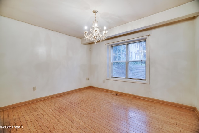 3122 Sparrow Ct, East Stroudsburg, PA 18302 - empty room with a chandelier and wood-type flooring