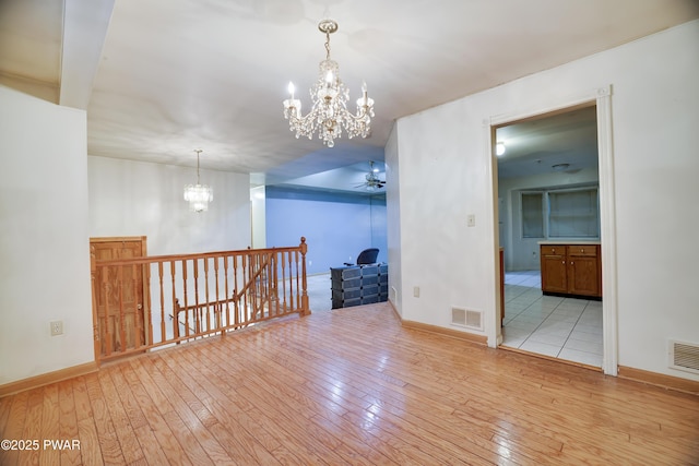 3122 Sparrow Ct, East Stroudsburg, PA 18302 - spare room featuring a chandelier, hardwood / wood-style floors, and a ceiling fan