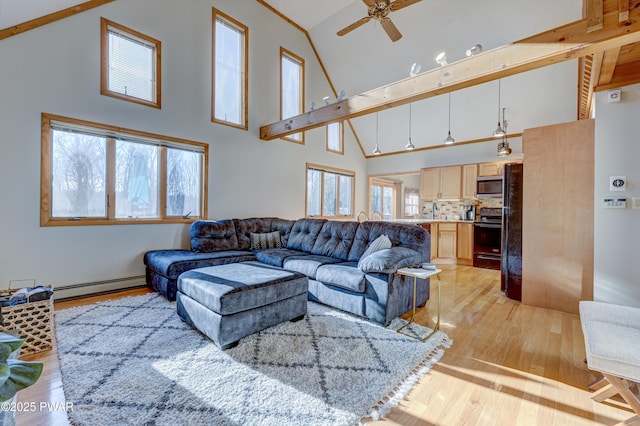 living room featuring high vaulted ceiling, a baseboard heating unit, and light wood-type flooring