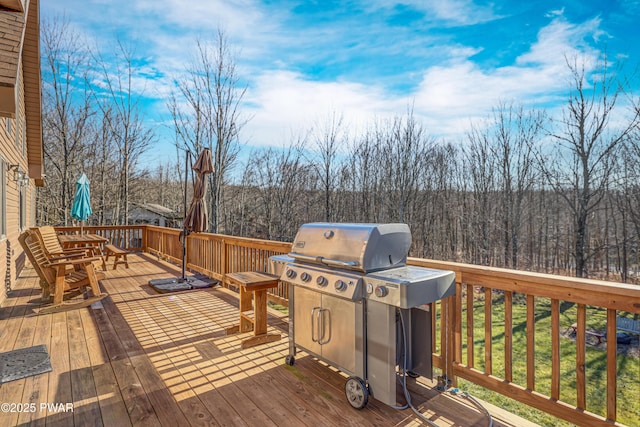 wooden deck featuring area for grilling