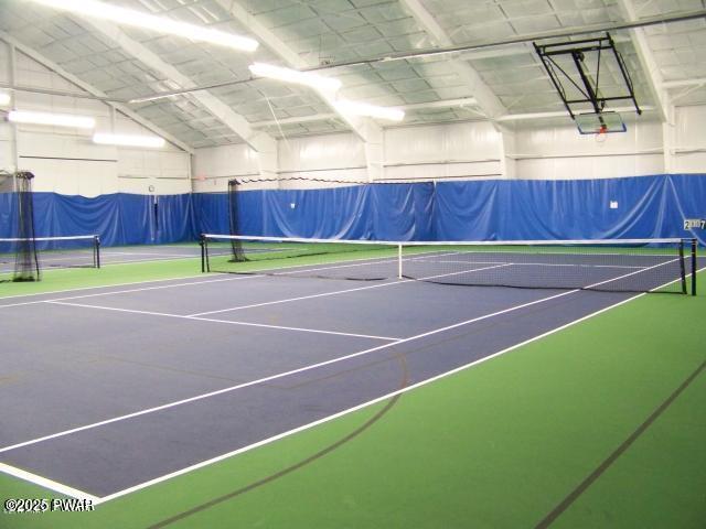 view of sport court featuring basketball hoop