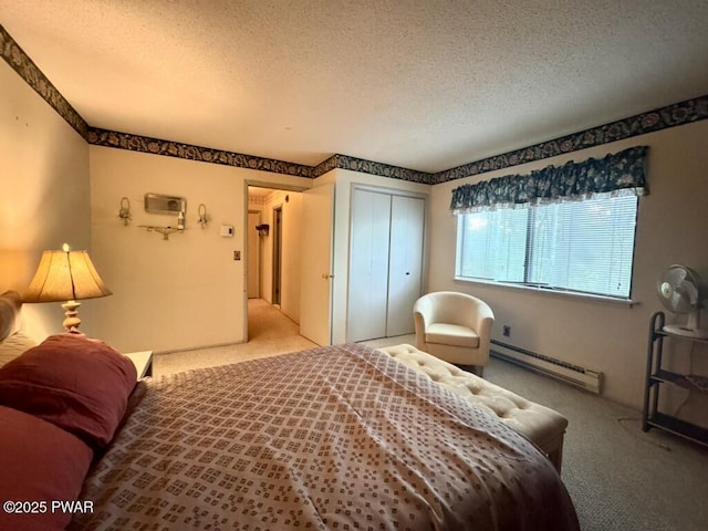 235 Falling Waters Blvd, Lackawaxen, PA 18435 - bedroom with baseboard heating, carpet, a textured ceiling, and a closet