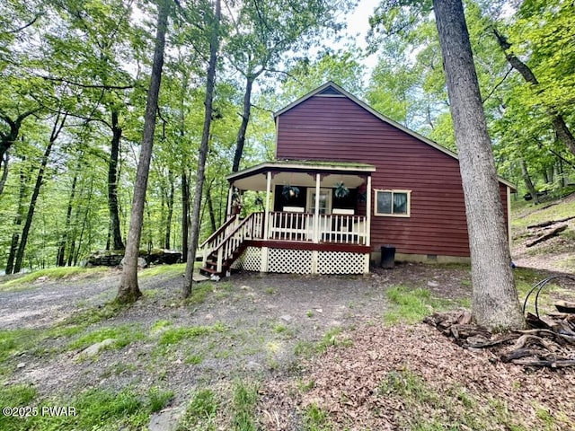 235 Falling Waters Blvd, Lackawaxen, PA 18435 - view of front of house featuring crawl space and covered porch