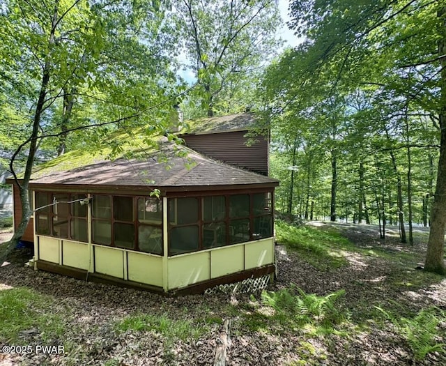 235 Falling Waters Blvd, Lackawaxen, PA 18435 - view of home's exterior featuring a sunroom and roof with shingles