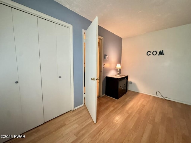 235 Falling Waters Blvd, Lackawaxen, PA 18435 - unfurnished bedroom with light wood finished floors and a closet