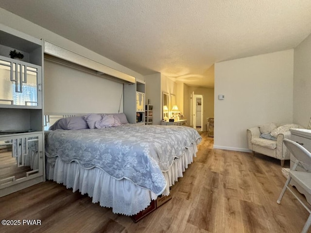 235 Falling Waters Blvd, Lackawaxen, PA 18435 - bedroom featuring wood finished floors and a textured ceiling
