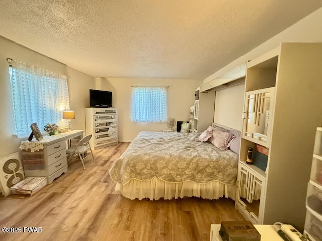 235 Falling Waters Blvd, Lackawaxen, PA 18435 - bedroom featuring a textured ceiling and wood finished floors