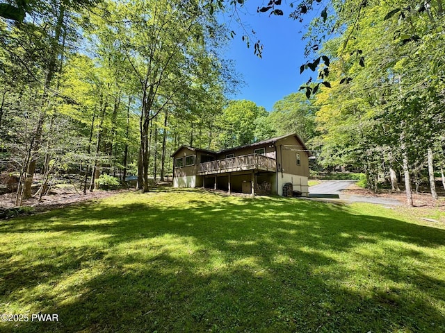 130 Grasshopper Ln, Greentown, PA 18426 - view of green lawn with a deck and a view of trees
