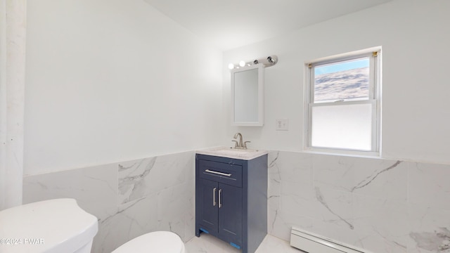 bathroom featuring vanity, toilet, tile walls, and a baseboard radiator