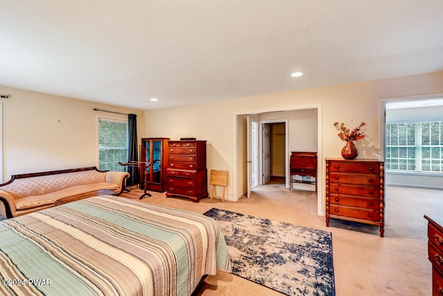 bedroom with light carpet