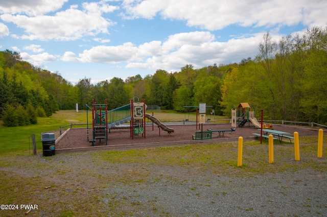 view of playground with a lawn