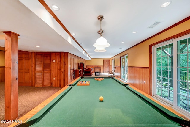 rec room with carpet, billiards, crown molding, and wood walls