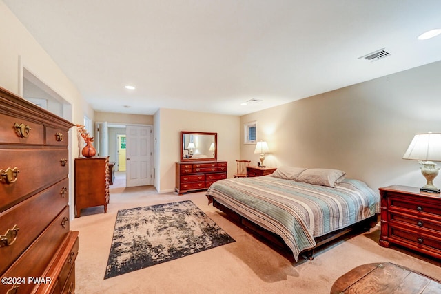 bedroom featuring light carpet