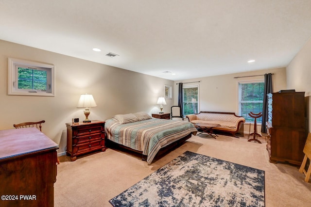 bedroom with light carpet