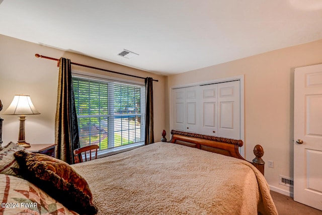 carpeted bedroom with a closet