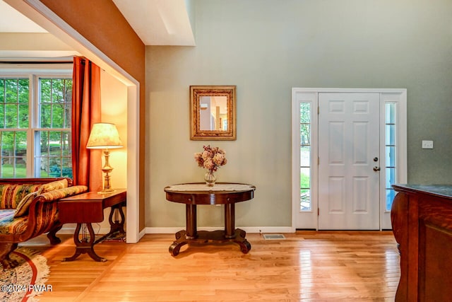 entryway with light hardwood / wood-style floors