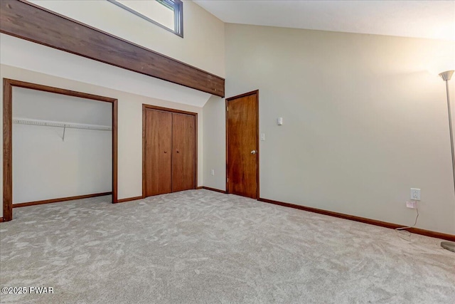 1180 Wallenpaupack Dr, Lake Ariel, PA 18436 - unfurnished bedroom with two closets, carpet floors, and lofted ceiling