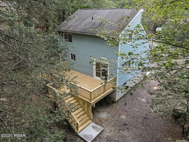 1180 Wallenpaupack Dr, Lake Ariel, PA 18436 - view of side of property with stairs, a deck, and a shingled roof
