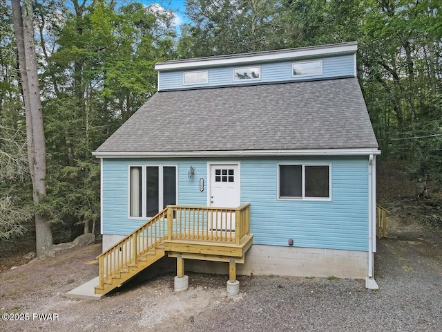 1180 Wallenpaupack Dr, Lake Ariel, PA 18436 - back of house featuring roof with shingles and view of scattered trees