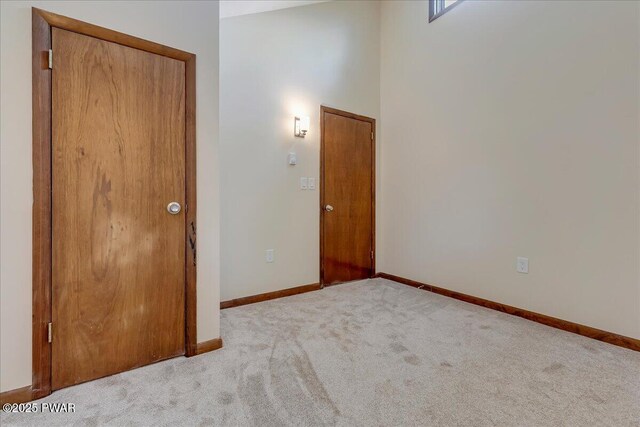 1180 Wallenpaupack Dr, Lake Ariel, PA 18436 - unfurnished bedroom with carpet floors and a towering ceiling