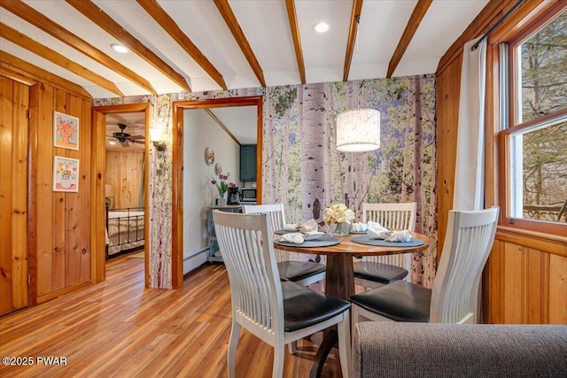 91 Bruin Rd, Lake Ariel, PA 18436 - dining space with wallpapered walls, beam ceiling, wood finished floors, healthy amount of natural light, and baseboard heating