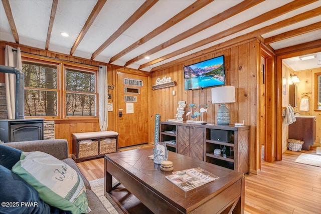91 Bruin Rd, Lake Ariel, PA 18436 - living area with a wood stove, wooden walls, beam ceiling, and wood finished floors