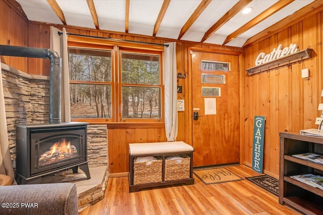 91 Bruin Rd, Lake Ariel, PA 18436 - foyer featuring a wood stove, wood finished floors, and wood walls